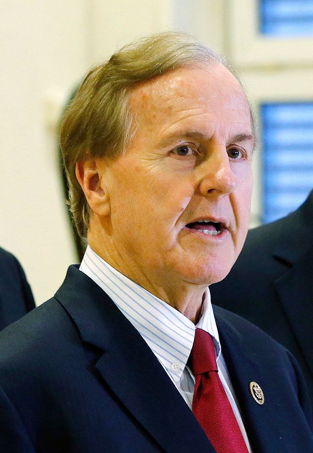 In this Jan. 18 photo, U.S. Rep. Robert Pittenger speaks to the media at the Landstuhl Regional Medical Center in Landstuhl, Germany. Pittenger, a Republican congressman who represents the Charlotte area, said Thursday that people are protesting in the city because they “hate white people.” (AP Photo/Michael Probst, File)