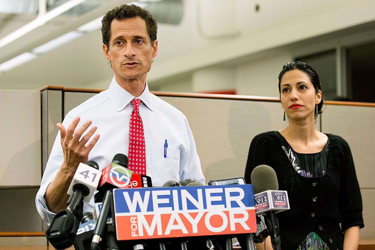 In 2013, then-New York mayoral candidate Anthony Weiner speaks during a news conference alongside his wife, Huma Abedin, in New York. (AP Photo/John Minchillo, File)