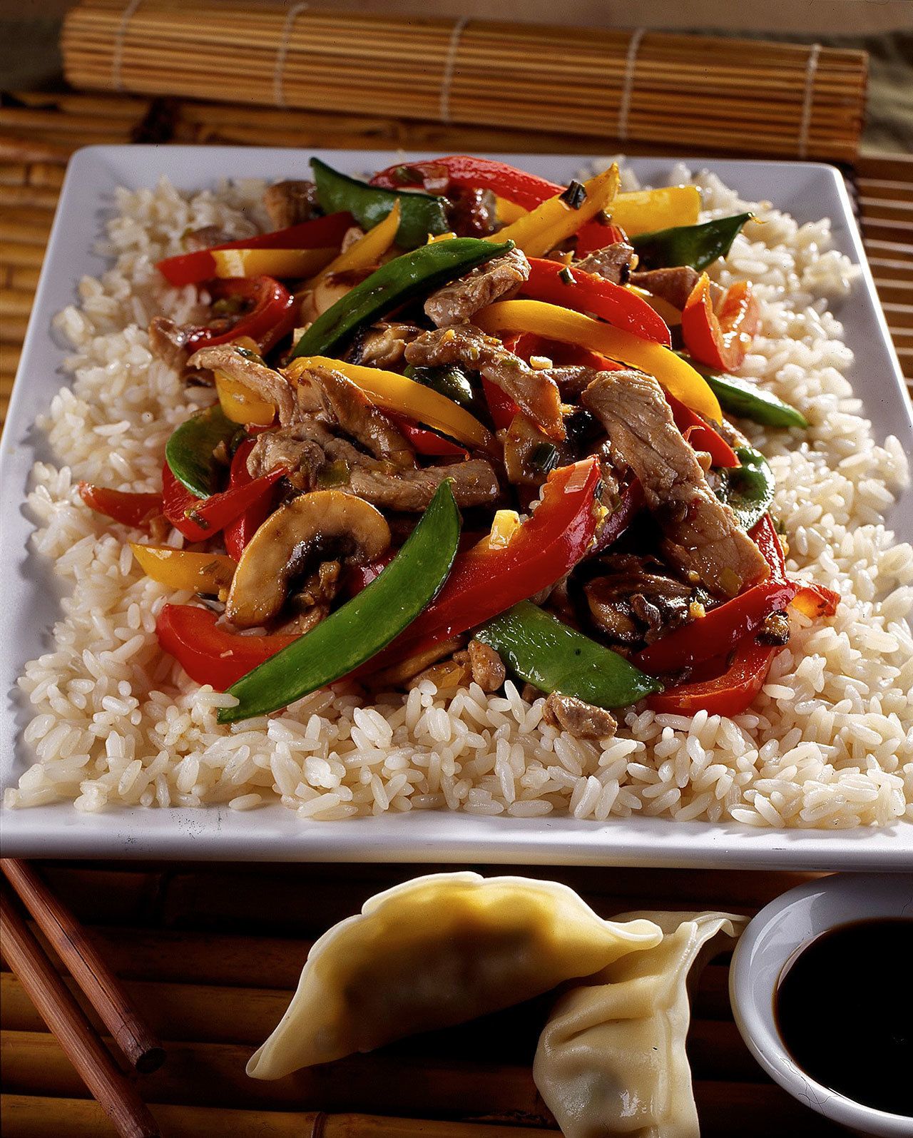 Bill Hogan / Chicago Tribune                                Pork, peppers, mushroom and pea pods make an easy stir-fry that’s even better with wine.