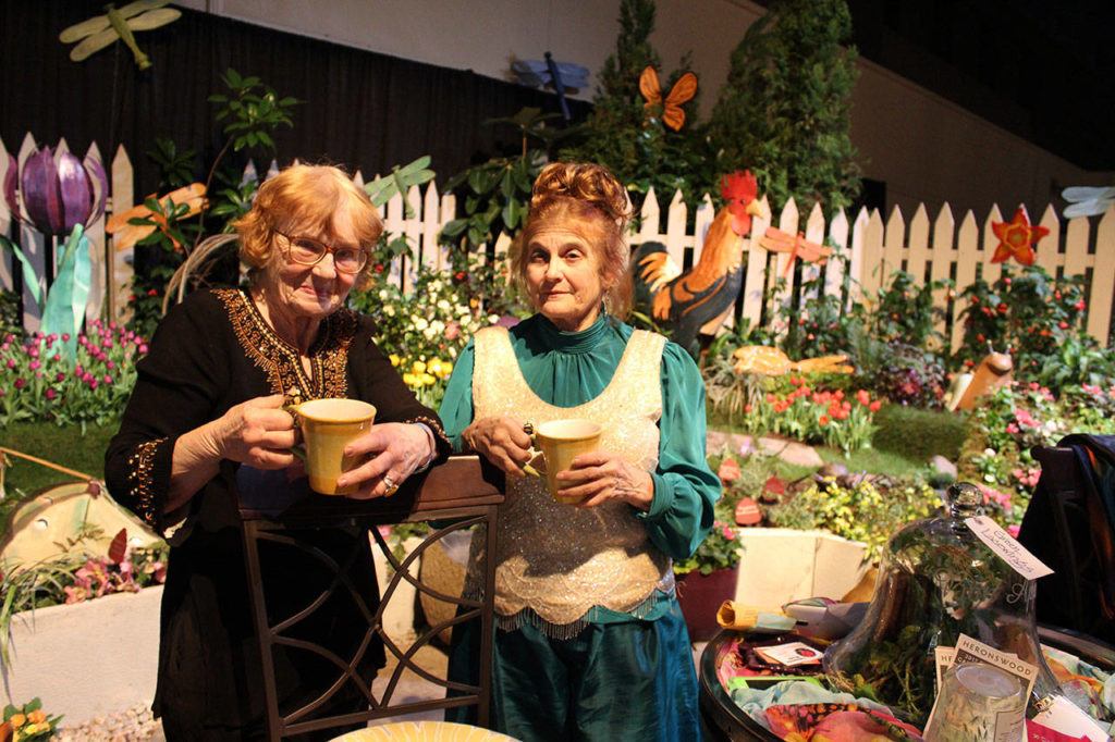 For more than 20 years, Vanca Lumsden of ALBE Rustics in Freeland (left) and Judith Jones of Fancy Fronds Nursery of Gold Bar have combined forces to create fanciful, fun displays at the annual Northwest Flower & Garden Show in Seattle. They’ve won Best of Show twice. (Patricia Guthrie / Whidbey News-Times)
