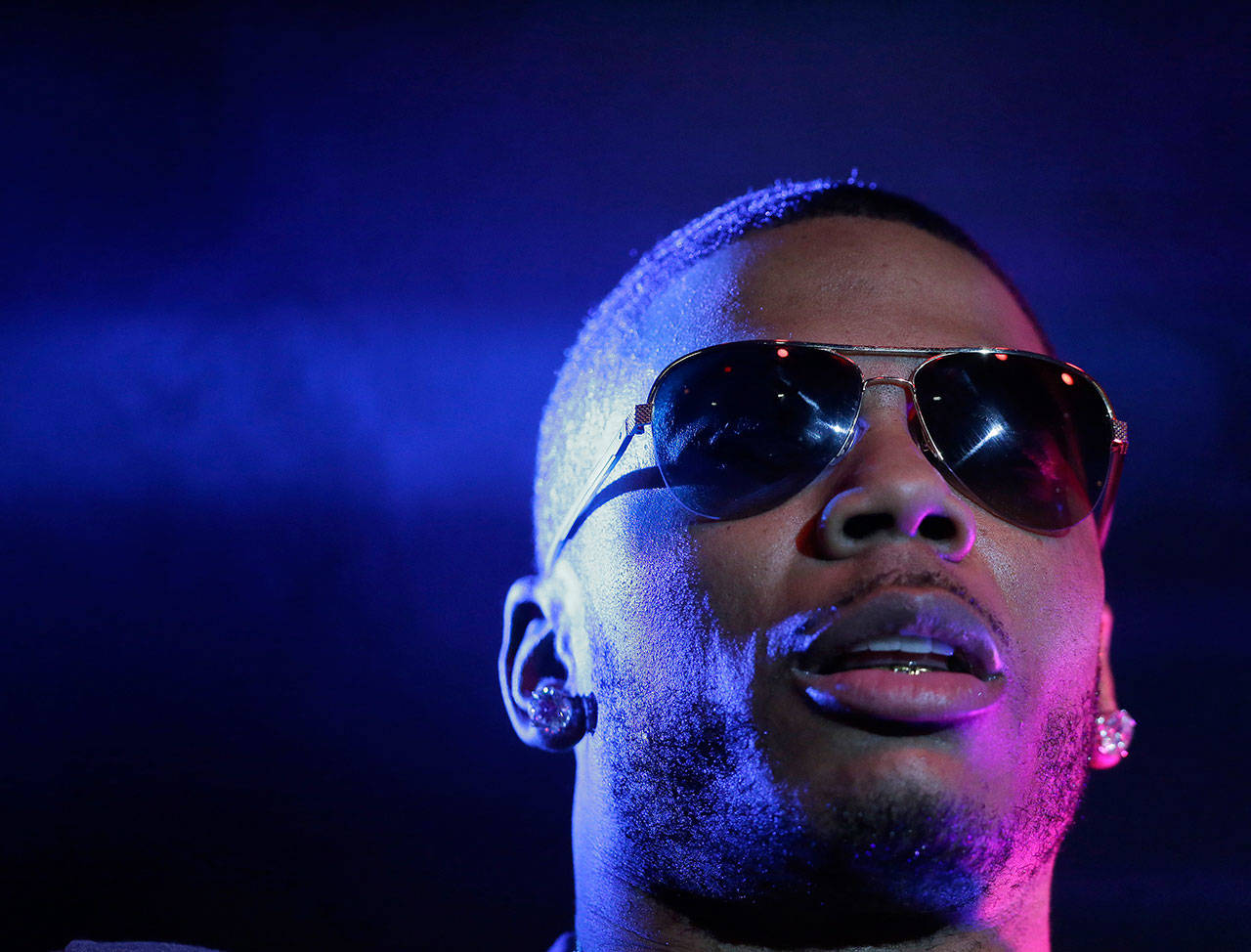 Rapper Nelly preforms on stage during a Corner Block Party concert at Auburn University in Auburn, Alabama, in 2015. Police arrested the performer after a woman said he raped her in his tour bus in Auburn, an accusation the Grammy winner’s attorney staunchly denies. (Associated Press file)