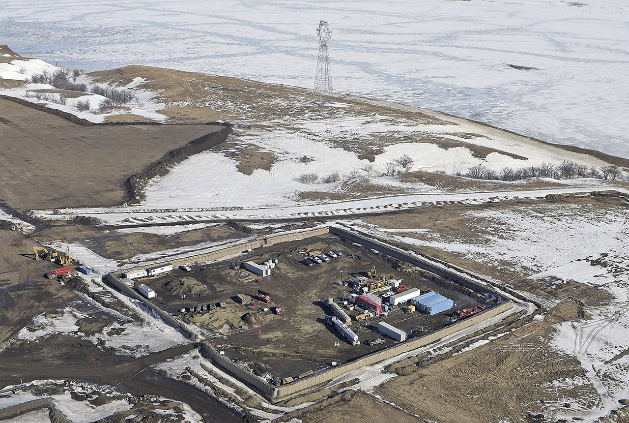 This Feb. 13 photo shows a site where the final phase of the Dakota Access Pipeline near the Missouri River took place with boring equipment routing the pipeline underground and across Lake Oahe to connect with the existing pipeline in Emmons County in Cannon Ball, North Dakota. (Tom Stromme/The Bismarck Tribune via AP, File)