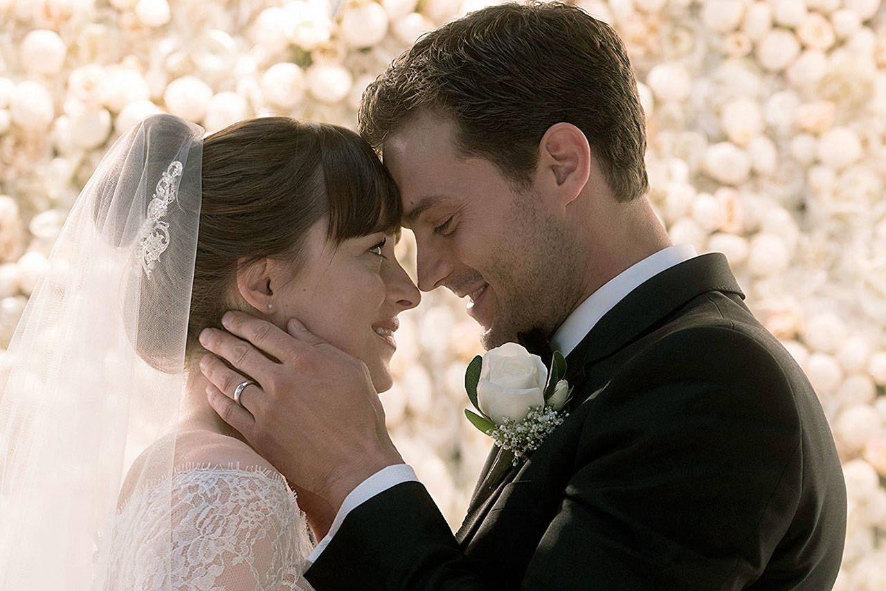 Believing they have left behind shadowy figures from their past, newlyweds Christian (Jamie Dornan) and Ana (Dakota Johnson) fully embrace an inextricable connection and shared life of luxury, but new threats could jeopardize their happy ending before it even begins in “Fifty Shades Freed.” (Universal Pictures)