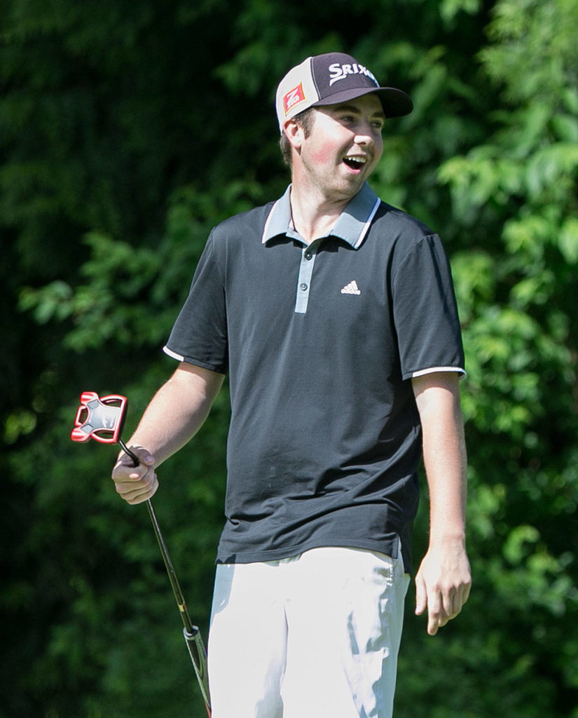 Halen Davis reacts to a putt on the second day of the 2018 Snohomish County Amateur golf tournament on May 27, 2018, at Harbour Pointe Golf Course in Mukilteo. (Kevin Clark / The Herald)
