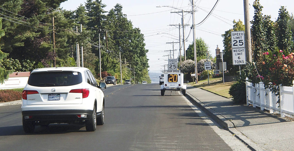 Federal Avenue in Everett’s Port Gardner neighborhood is a residential area and home to schools. Residents say speeding is a problem as drivers use the road as a shortcut. A speed radar sign installed after summer roadwork that removed a speed hump serves as a reminder of the 25 mph speed limit. (Herald file)
