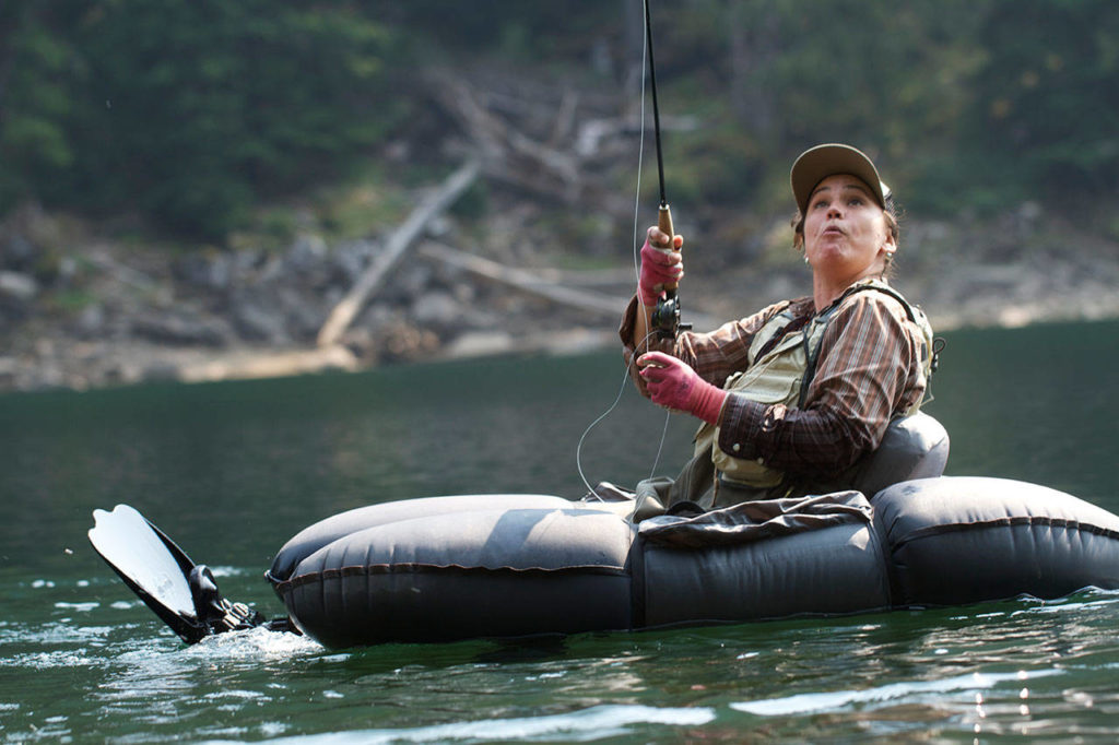 Anna Oenbring of Granite Falls enjoys fighting a jumping cutthroat at Slide Lake. (Mike Benbow photo)
