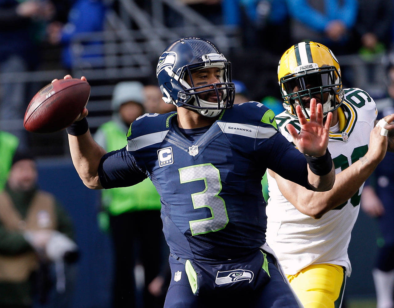 Marshawn Lynch (24) of the Seattle Seahawks catches a pass against the Green  Bay Packers in the NFC Championship game at CenturyLink Field in Seattle,  Washington on January 18, 2015. Photo by