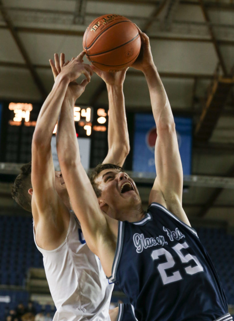 Glacier Peak’s Noah Forman (left) and Curtis’ Zack Paulsen jump for a rebound with Wednesday afternoon at the Tacoma Dome on February 27, 2019. The Grizzles lost 46-43. (Kevin Clark / The Herald)
