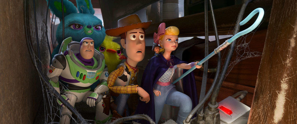 Woody is joined by old pals Buzz Lightyear (voiced by Tim Allen) and Bo Peep (voiced by Annie Potts) in “Toy Story 4.” (Disney / Pixar)
