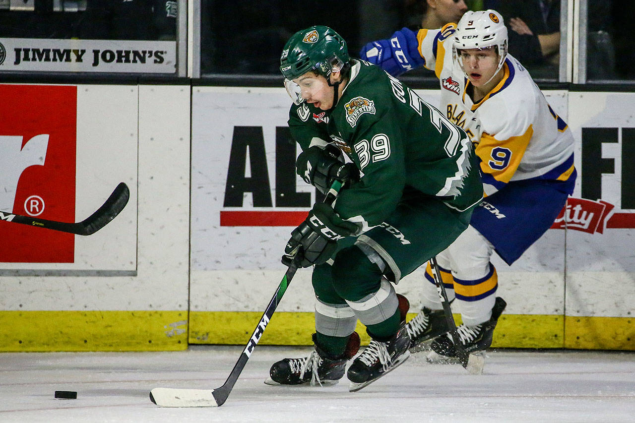 The Silvertips’ Gage Goncalves (left) controls the puck with the Blades’ Jayden Wiens defending on Nov. 22, 2019, at Angel of the Winds Arena in Everett. (Kevin Clark / The Herald)