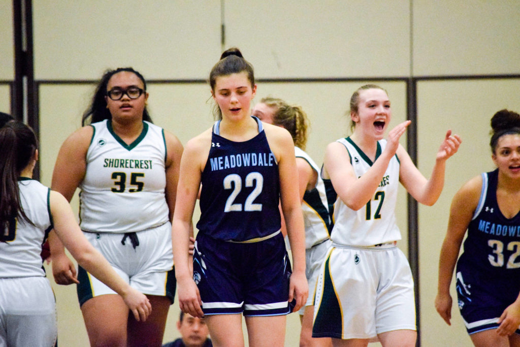 Shorecrest’s Taylor Svendsen (12) claps after making a defensive stop against Meadowdale on Thursday, Jan. 30 at Shorecrest High School in Shoreline. (Katie Webber / The Herald)
