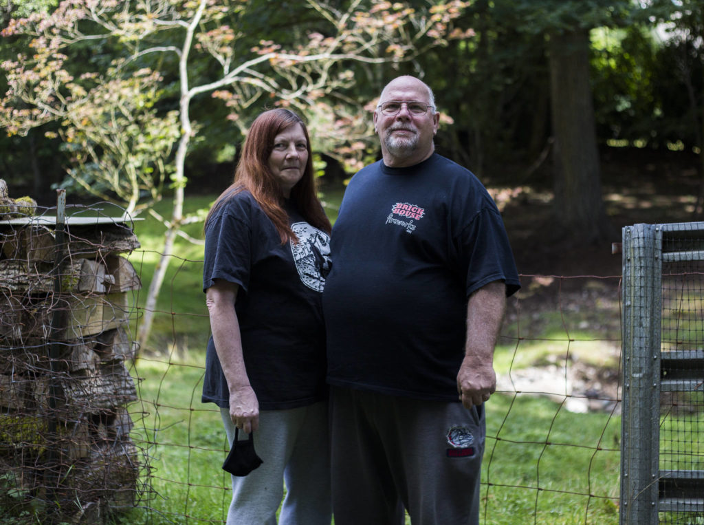 Sandy Lambertson (left) and husband Doug at their home in Lake Stevens. (Olivia Vanni / The Herald) 