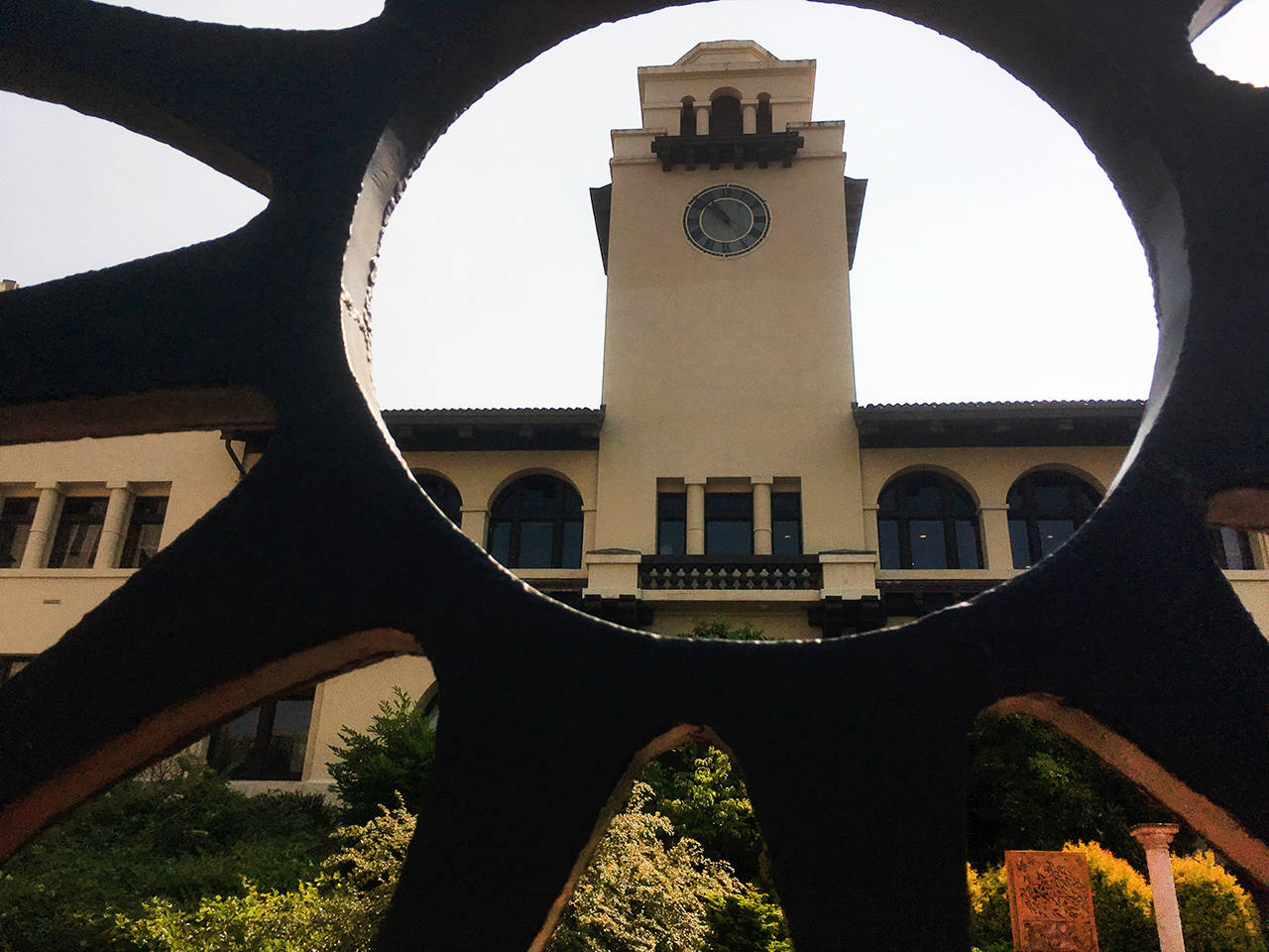 The Mission Building on the Snohomish County government campus is seen through a sculpture. (Sue Misao / The Herald)