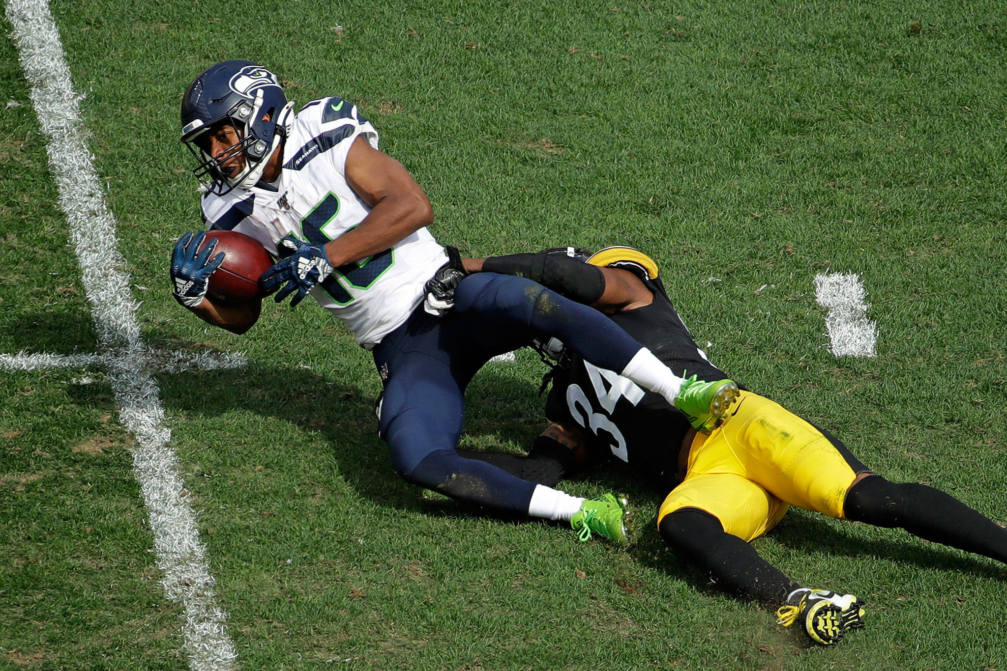 Seahawks wide receiver Tyler Lockett (16) is tackled by Steelers strong safety Terrell Edmunds (34) during a game in 2019 in Pittsburgh. (AP Photo/Gene J. Puskar)