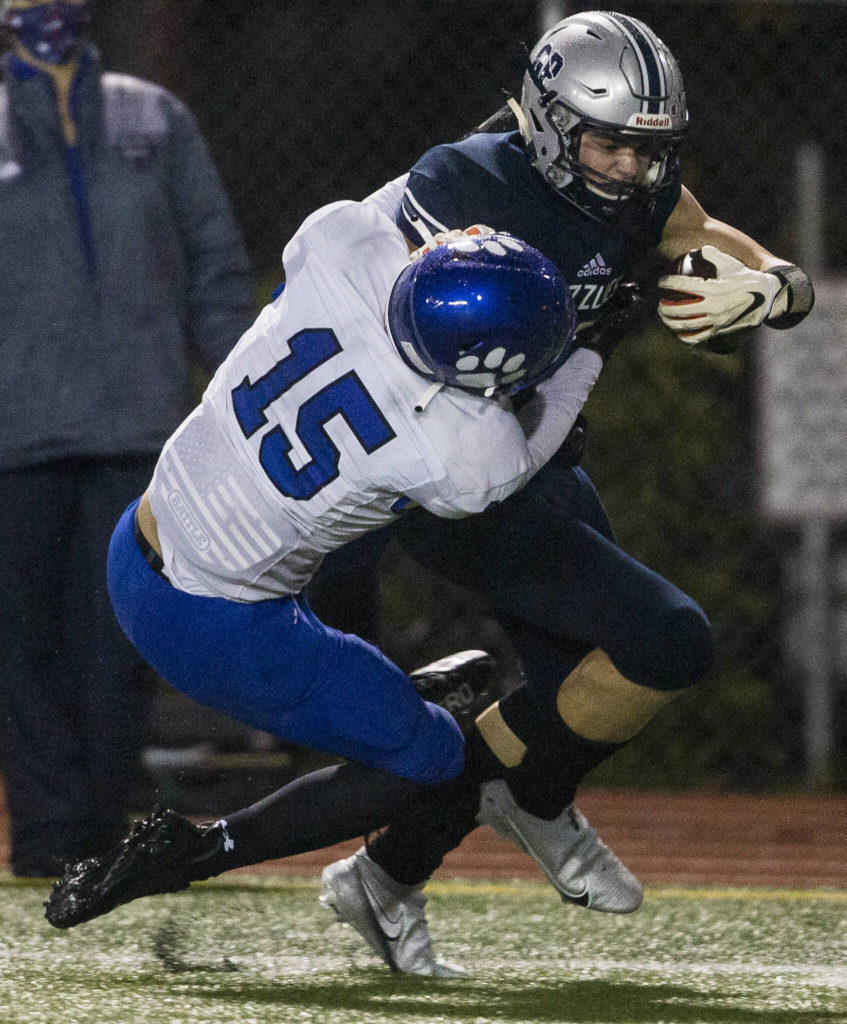 Glacier Peak’s Trey Leckner pushes Bothell’s Sam Stewart while running with the ball on Friday, Nov. 12, 2021 in Snohomish, Wa. (Olivia Vanni / The Herald)
