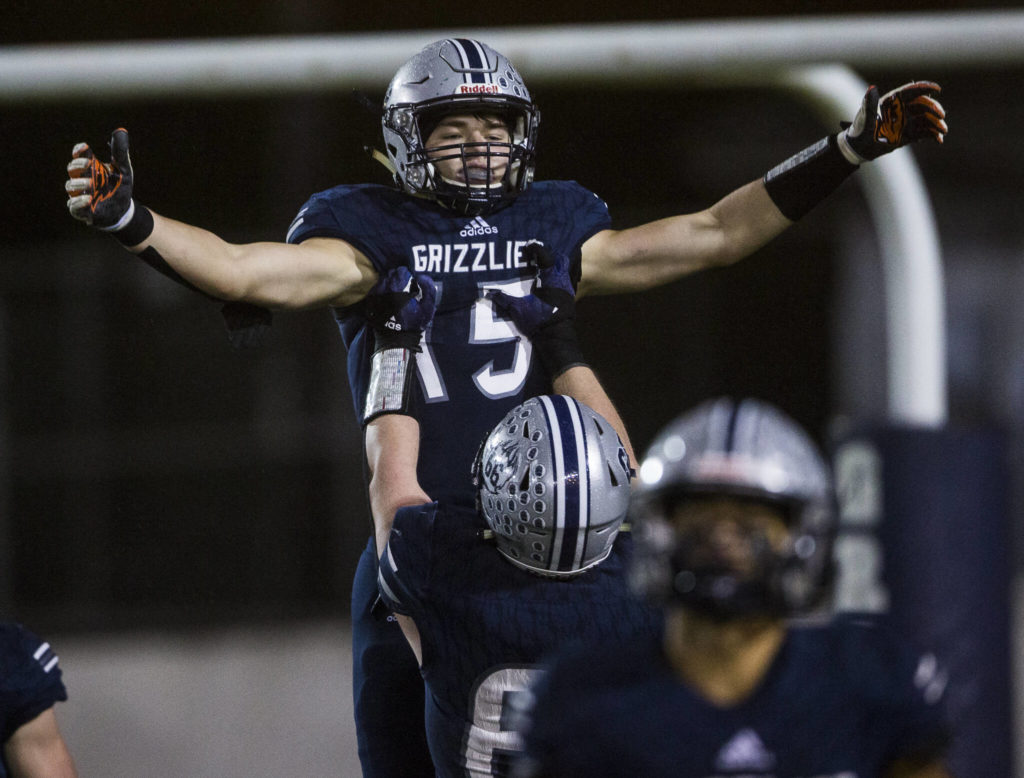 Glacier Peak’s Trey Leckner is hoisted in the air by his teammate in celebration of his touchdown during the game against Bothell on Friday, Nov. 12, 2021 in Snohomish, Wa. (Olivia Vanni / The Herald)
