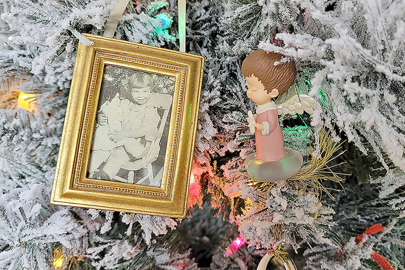 Caption: Family photos like this one of the author’s grandmother give extra meaning to this family’s holiday decorations.