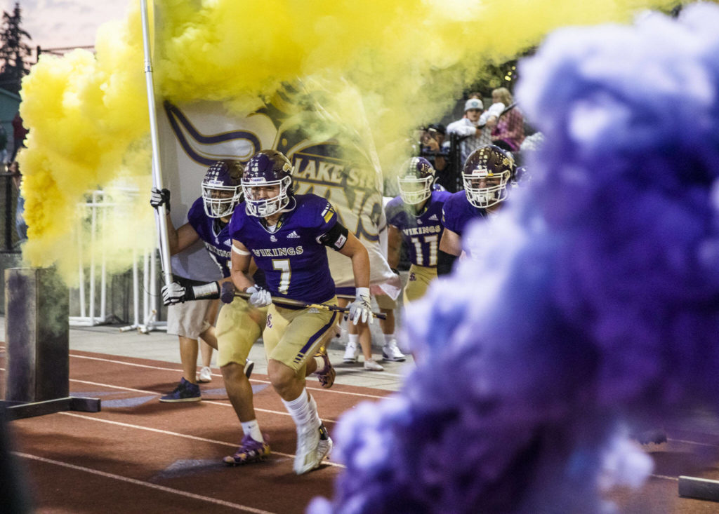 The Lake Stevens players run out onto the field before the start of the game against Eastlake on Friday, Oct. 7, 2022 in Lake Stevens, Washington. (Olivia Vanni / The Herald)
