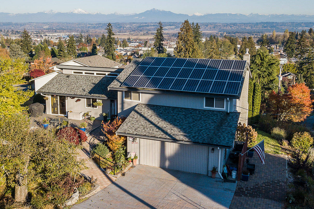 Solar panels are visible along the rooftop of the Crisp family home on Monday, Nov. 14, 2022 in Everett, Washington. (Olivia Vanni / The Herald)