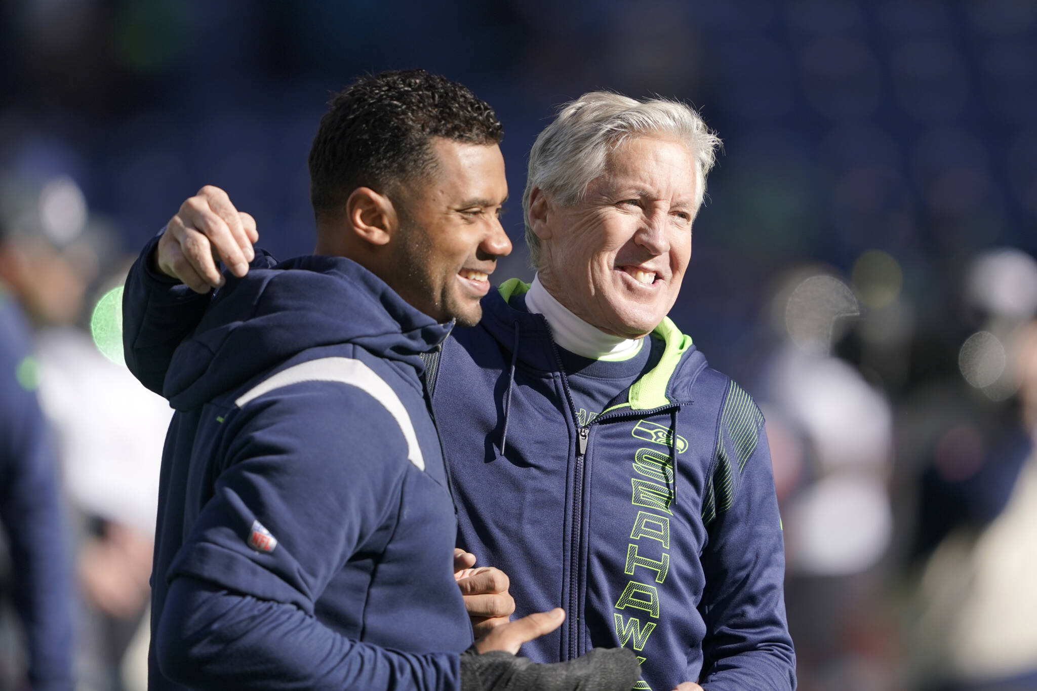 Seahawks QB Russell Wilson throws some passes with his left hand