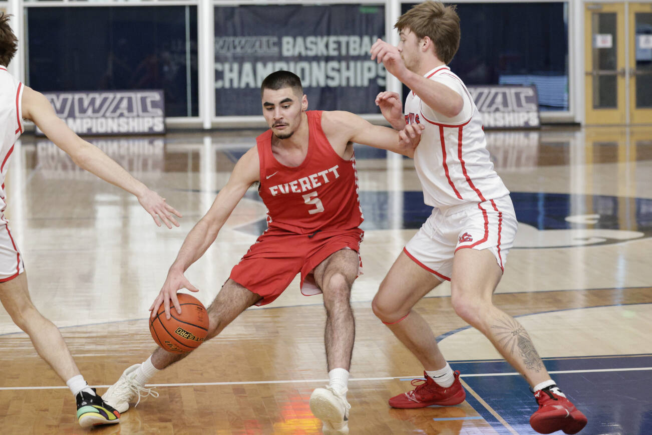 Everett Community College's Tucker Molina (left) drives to the basket during a NWAC men's tournament quarterfinal game against Lower Columbia on Saturday, March 11, 2023, at Columbia Basin College in Pasco. (Dan Acosta / EvCC Athletics)