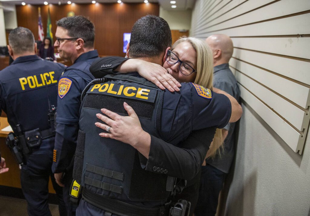 Olivia Vanni / The Herald
Snohomish County Sheriff’s Office detective Kendra Conley hugs Everett police Lt. Tim Collings after Richard Rotter was found guilty on April 3 in Everett. Rotter got life without parole for slaying Everett police officer Dan Rocha in March 2022.
