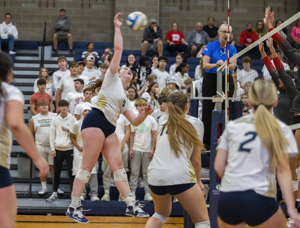 Arlington’s Melissa Hadley spikes the ball during the game against Stanwood on Sept. 19 in Arlington. (Olivia Vanni / The Herald)
