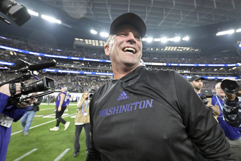 Washington coach Kalen DeBoer smiles after the team’s victory over Oregon in the Pac-12 championship NCAA college football game on Dec. 1 in Las Vegas. DeBoer has made a rapid rise through the coaching ranks. He won three NAIA national championships as head coach at the University of Sioux Falls from 2005-09 and had five coaching stops in 12 years before landing at Washington. (Associated Press)
