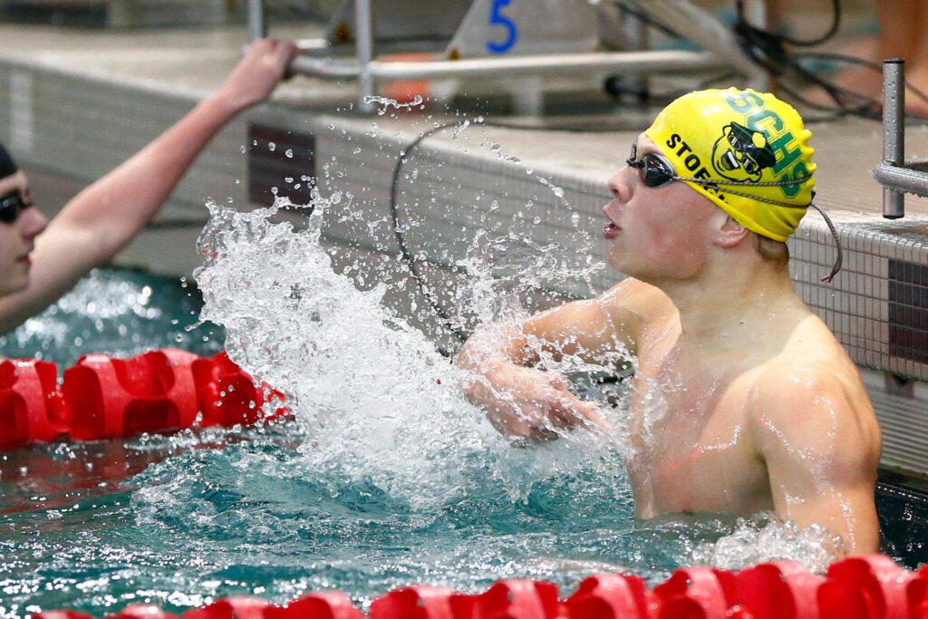Shorecrest junior Colton Stoecker celebrates a come-from-behind win in the 200-yard freestyle during the 3A District 1 championship meet Feb. 10 at the Snohomish Aquatic Center in Snohomish. (Ryan Berry / The Herald)
