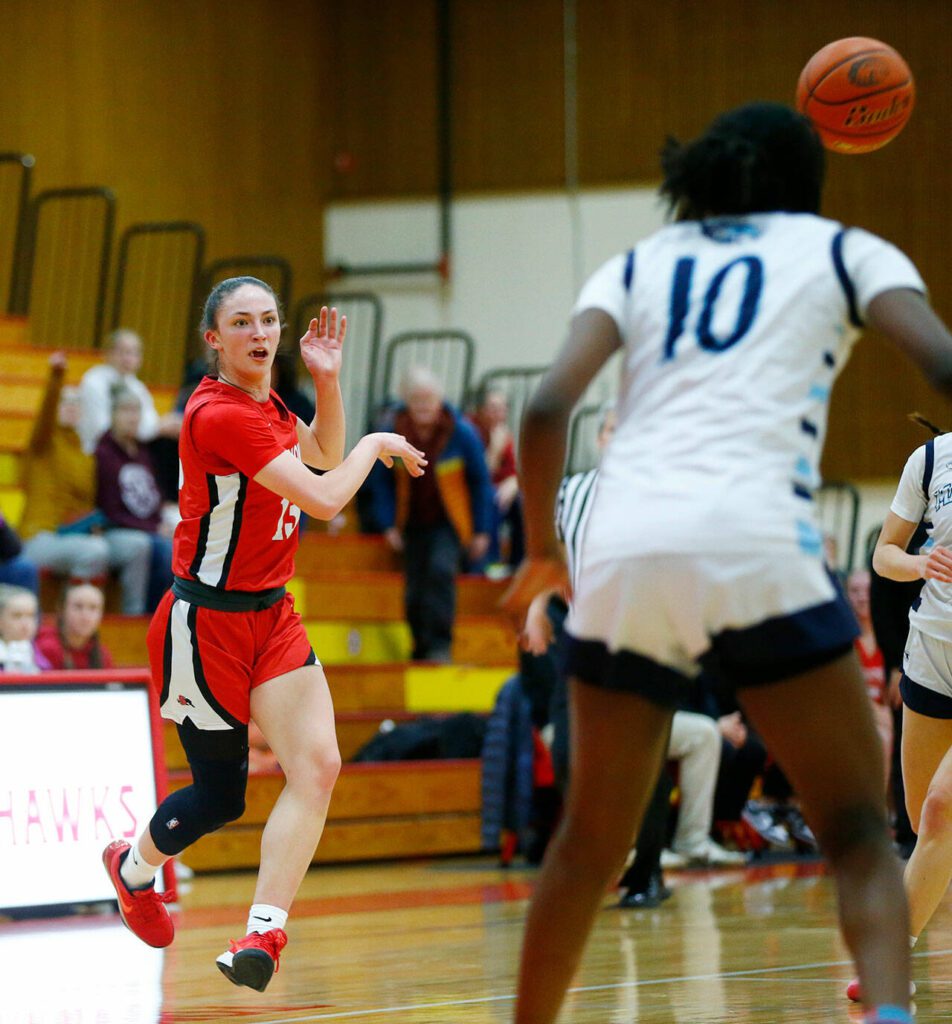 Snohomish’s Sienna Capelli makes a no-look pass to a teammate against Meadowdale during the 3A District One Semifinals on Wednesday, Feb. 14, 2024, at Marysville Pilchuck High School in Marysville, Washington. (Ryan Berry / The Herald)
