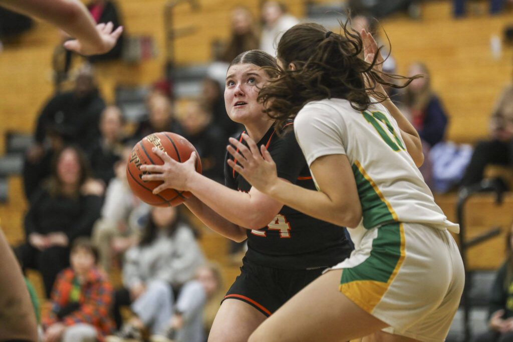 Monroe’s Brooklyn Krache (24) shoots the ball during a 3A girls game between Monroe and Roosevelt at Roosevelt High School on Tuesday, Feb. 20, 2024, in Seattle, WA. Monroe fell, 58-37. (Annie Barker / The Herald)
