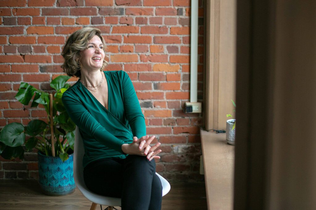 Maygen Hetherington, executive director of the Historic Downtown Snohomish Association, laughs during an interview in her office on Thursday, Feb. 15, 2024, in Snohomish, Washington. (Ryan Berry / The Herald)
