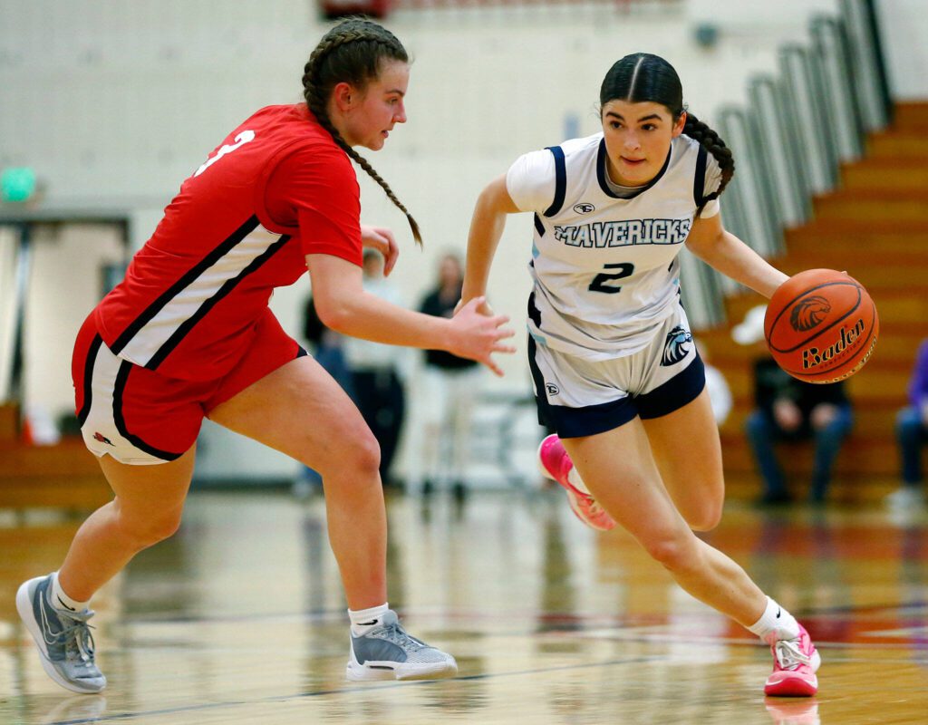 Meadowdale’s Gia Powell tries to get past a defender against Snohomish during the a district semifinal game Feb. 14 at Marysville Pilchuck High School in Marysville. (Ryan Berry / The Herald)
