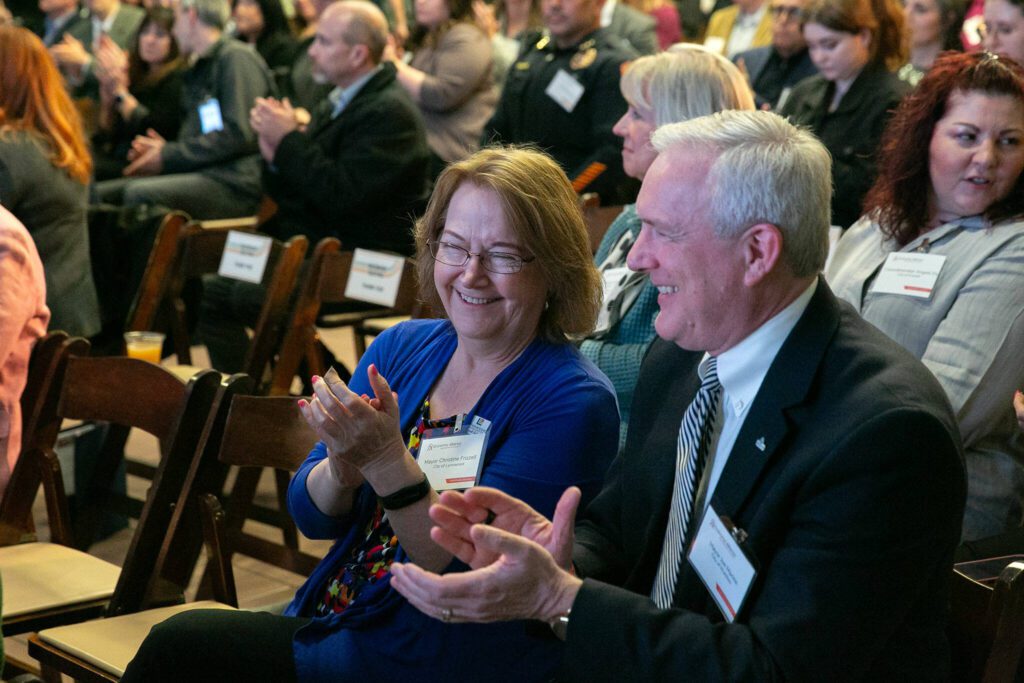 Lynnwood Mayor Christine Frizzell and Mukilteo Mayor Joe Marine sit together during Everett’s State of the City Address on Thursday, March 21, 2024, at the Everett Mall in Everett, Washington. (Ryan Berry / The Herald)
