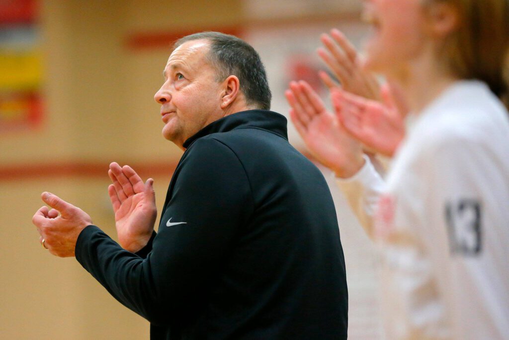 Snohomish head coach Ken Roberts claps for a player’s 3-pointer in against Stanwood on Jan. 13, 2023, at Snohomish High School in Snohomish. (Ryan Berry / The Herald)
