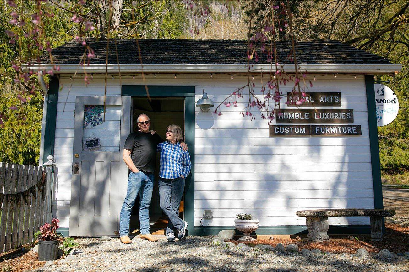 Allan and Frances Peterson, a woodworker and artist respectively, stand in the door of the old horse stable they turned into Milkwood on Sunday, March 31, 2024, in Index, Washington. (Ryan Berry / The Herald)