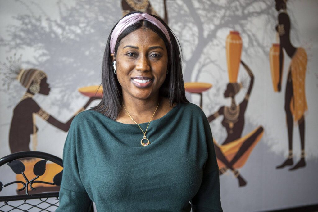 Owner Fatou Dibba poses for a photo at the African Heritage Restaurant on Saturday, April 6, 2024 in Everett, Washington. (Annie Barker / The Herald)
