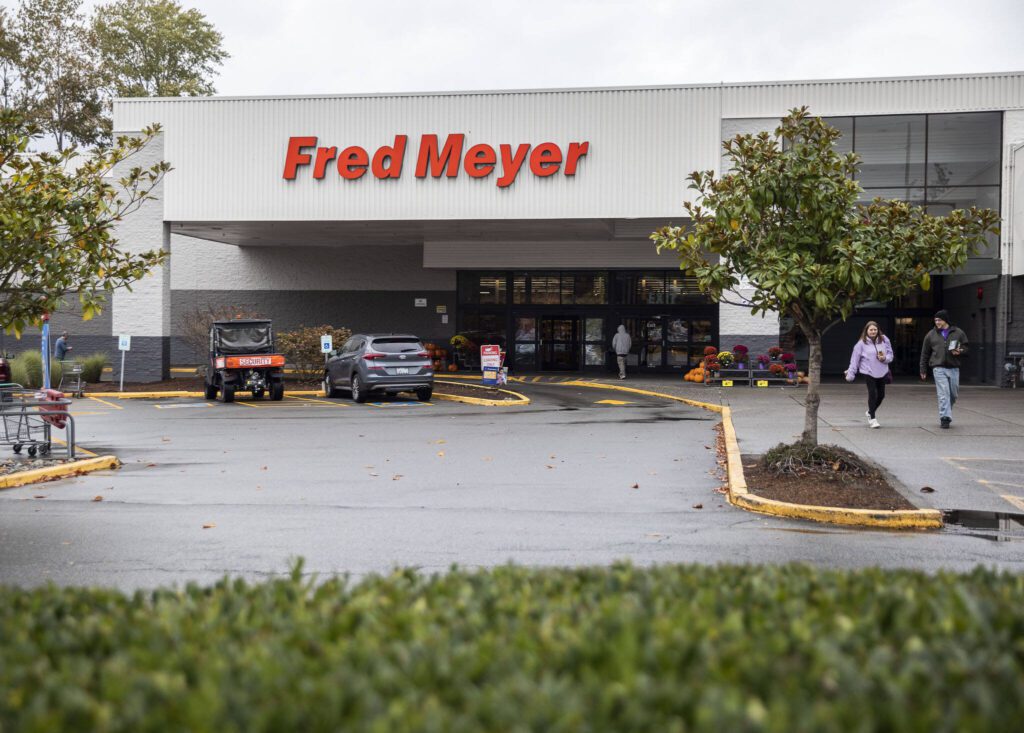 People walk in and out of Fred Meyer along Evergreen Way and Casino Road on Tuesday, Oct. 24, 2023 in Everett, Washington. (Olivia Vanni / The Herald)
