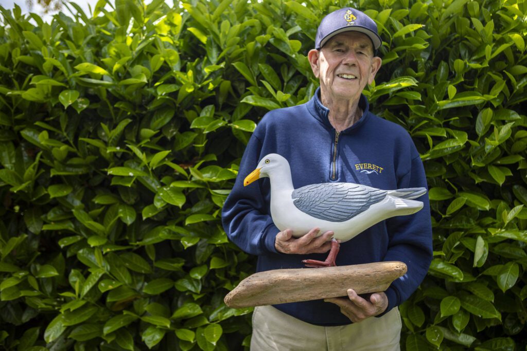 Lawrence E. O’Donnell poses for a photo with Sammy the Seagull, gifted by a friend, at his brother Jack’s home in Everett, Washington on Wednesday, May 29, 2024. (Annie Barker / The Herald)
