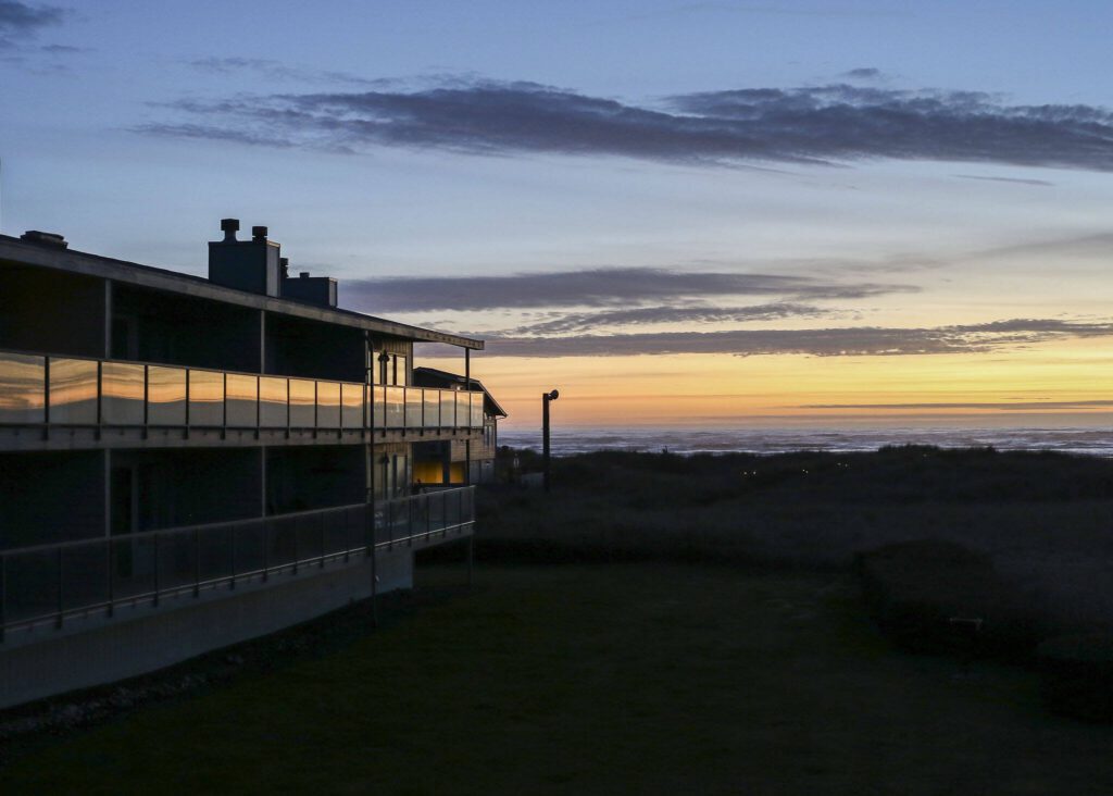 The decks at Hi-Tide Ocean Beach Resort reflect the evening’s sun set colors on March 13 in Moclips, Washington. (Brenda Mann Harrison / Special to The Herald)
