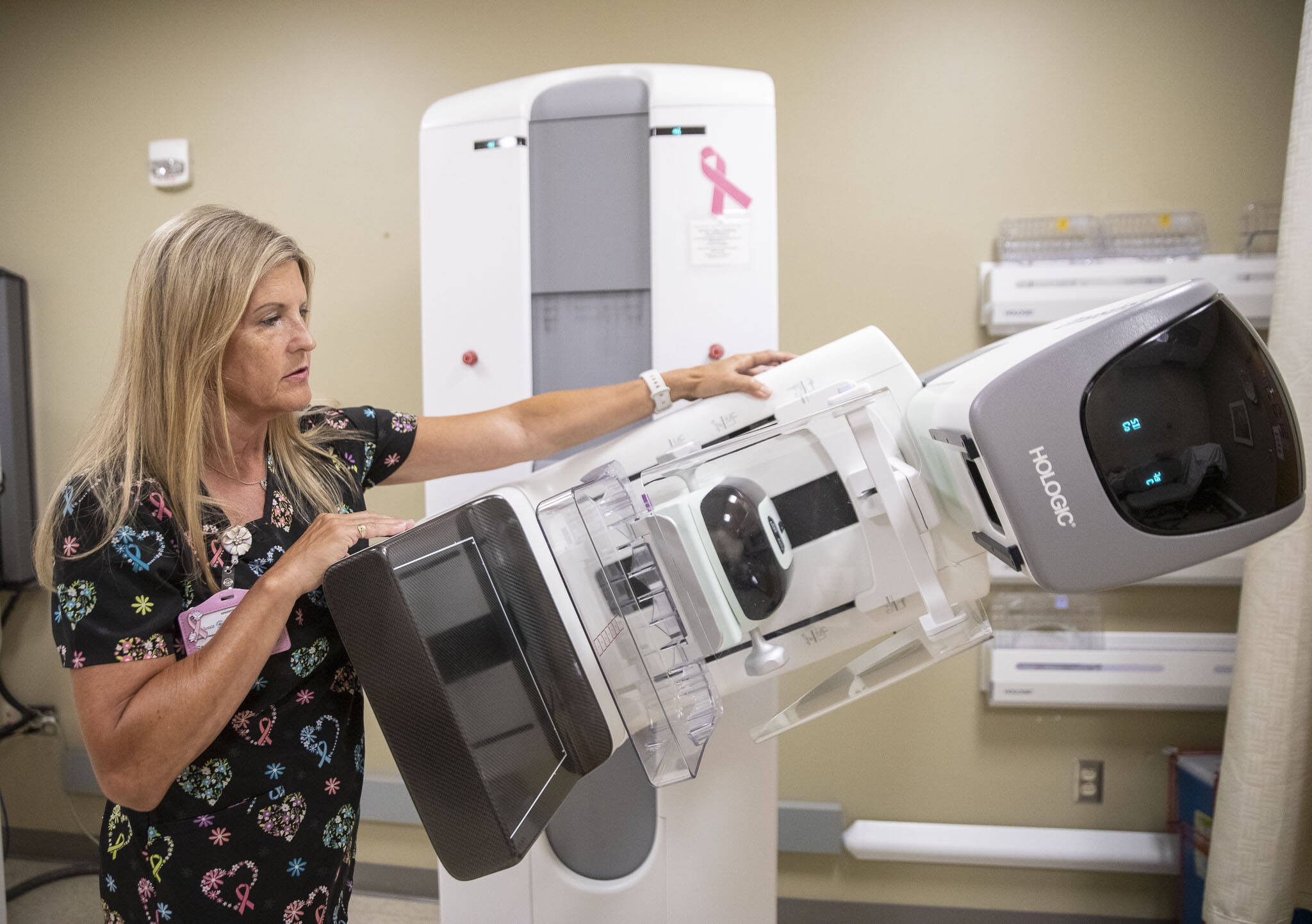 Lead Mammography Technologist Starla DeLap talks about the ways the Hologic 3D Mammography Exam can be situated around a patient on Wednesday, July 10, 2024, in Everett, Washington. (Olivia Vanni / The Herald)