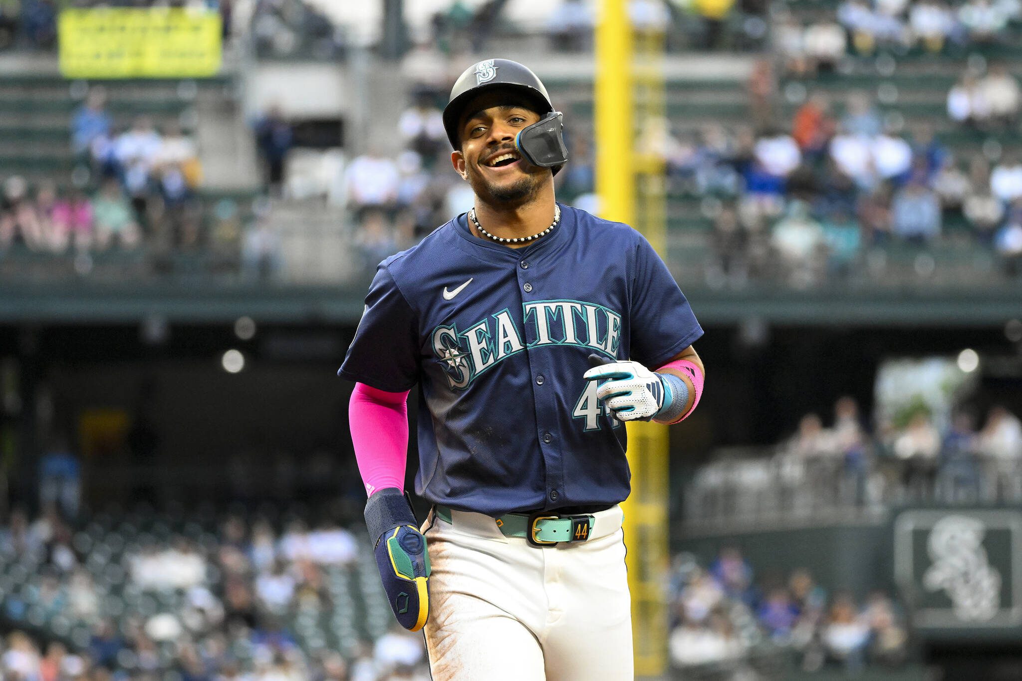 Julio Rodriguez of the Seattle Mariners smiles after scoring off a double by teammate Cal Raleigh during the third inning against the Chicago White Sox at T-Mobile Park on Tuesday, June 11, 2024, in Seattle. (Alika Jenner / Tribune News Service)