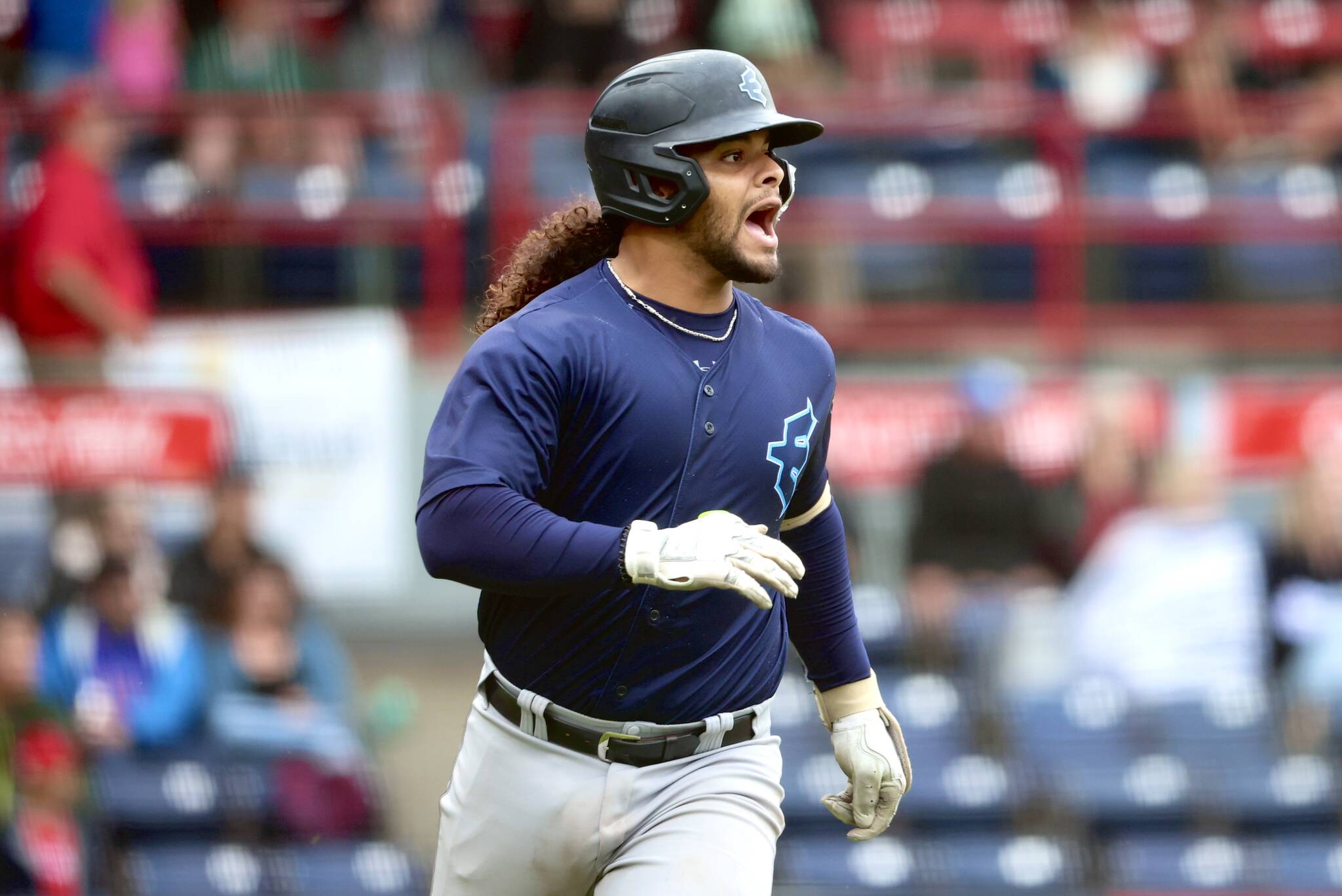 AquaSox catcher Freuddy Batista reacts while running down the first-base line during Everetts game against the Vancouver Canadians on Friday, Aug. 23, at Nat Bailey Stadium in Vancouver, B.C. (Photo courtesy of Evan Morud / Everett AquaSox)