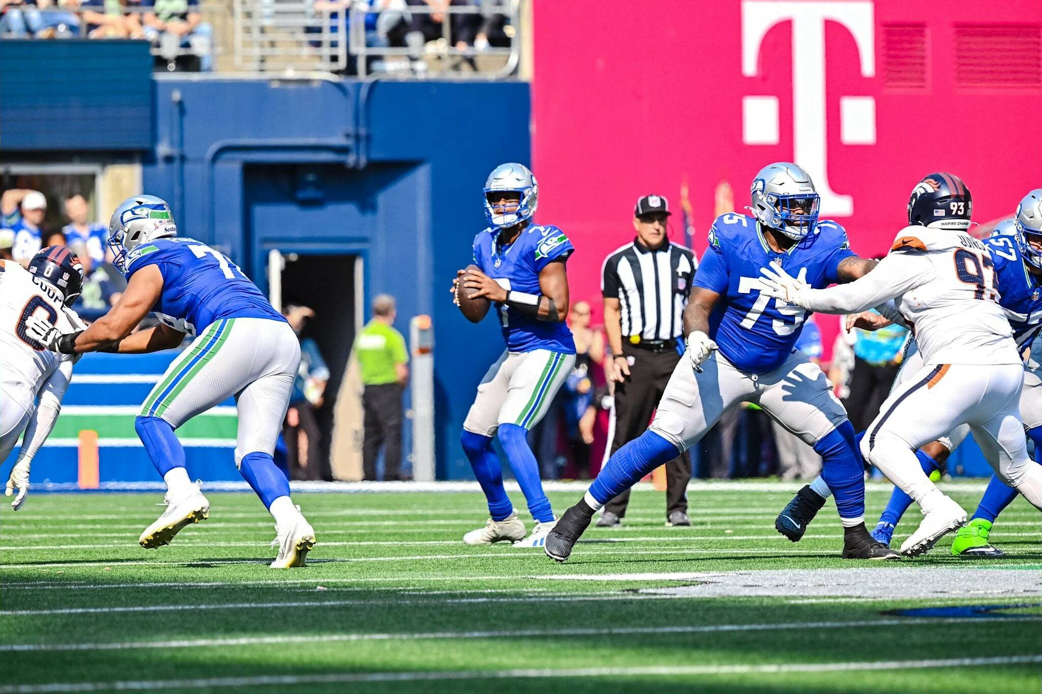 Seahawks offensive linemen Stone Forsythe (78), Anthony Bradford (75) and Connor Williams (57) block for quarterback Geno Smith (7) in the season-opening game against the Denver Broncos at Lumen Field on Sept. 8, 2024 (Photo courtesy of the Seattle Seahawks)