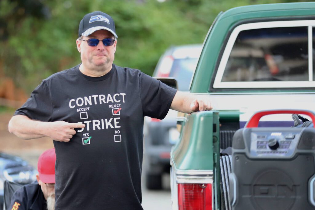 Boeing employee Patrick Casey shows off a T-shirt made by his wife at Kasch Park in Everett, Washington, on Thursday, Sept. 12 2024. (Michael Henneke / The Herald)
