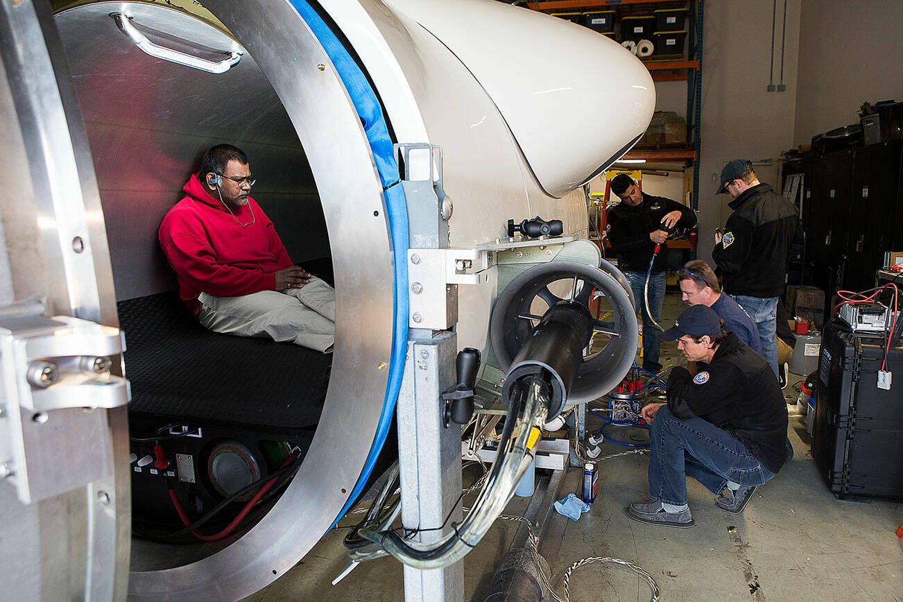 OceanGate engineer Mark Walsh programs control software as engineering technicians get the Titan submersible ready for testingngineers get the Titan submersible ready for testing on Monday, March 12, 2018 in Everett, Wa. (Andy Bronson / The Herald)