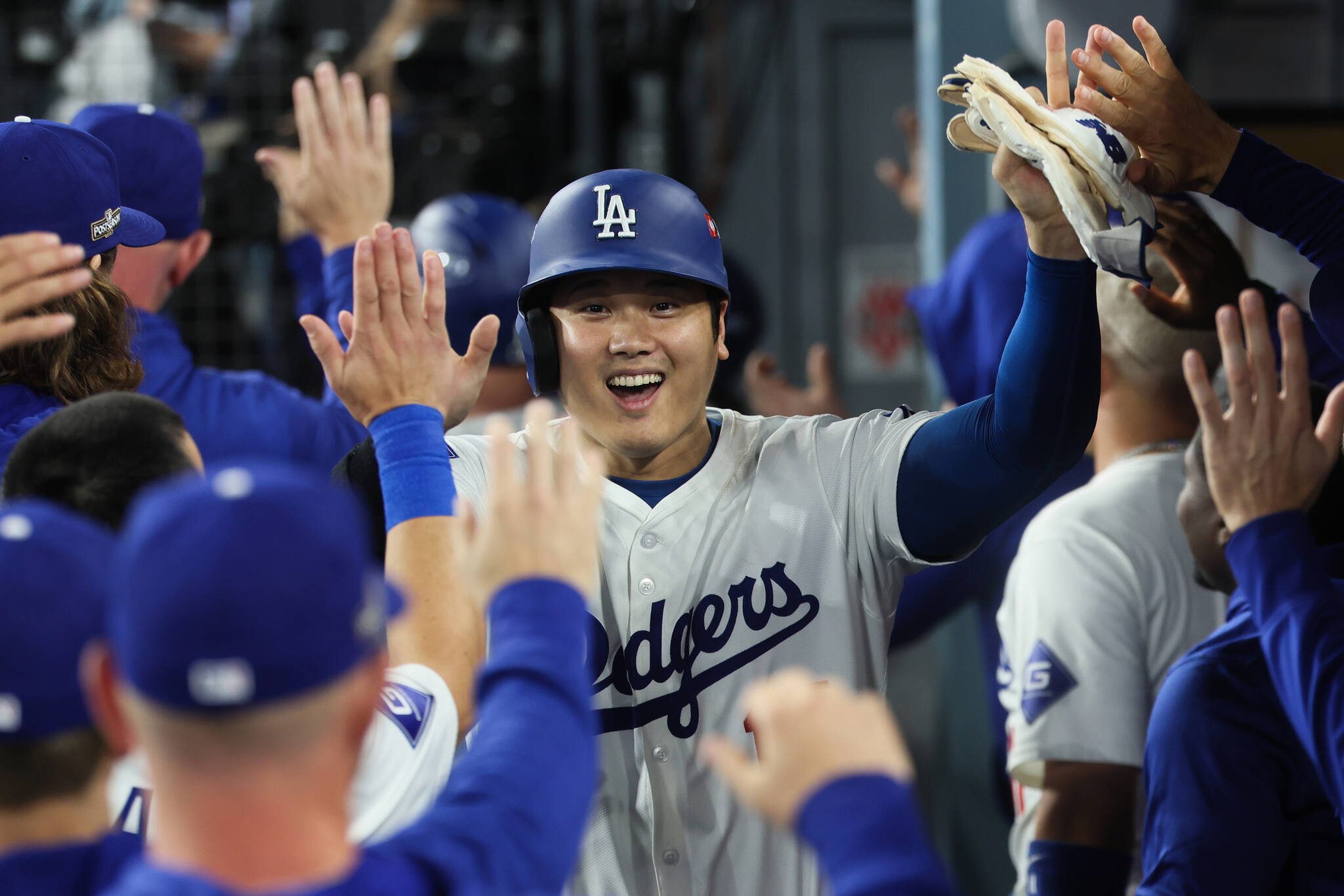 Shohei Ohtani of the Los Angeles Dodgers celebrates after scoring on a two-run single by Teoscar Hernandez during the fourth inning in the N.L. Division Series against the San Diego Padres at Dodger Stadium on Saturday, Oct. 5, 2024, in Los Angeles. (Robert Gauthier / Los Angeles Times / Tribune News Services)