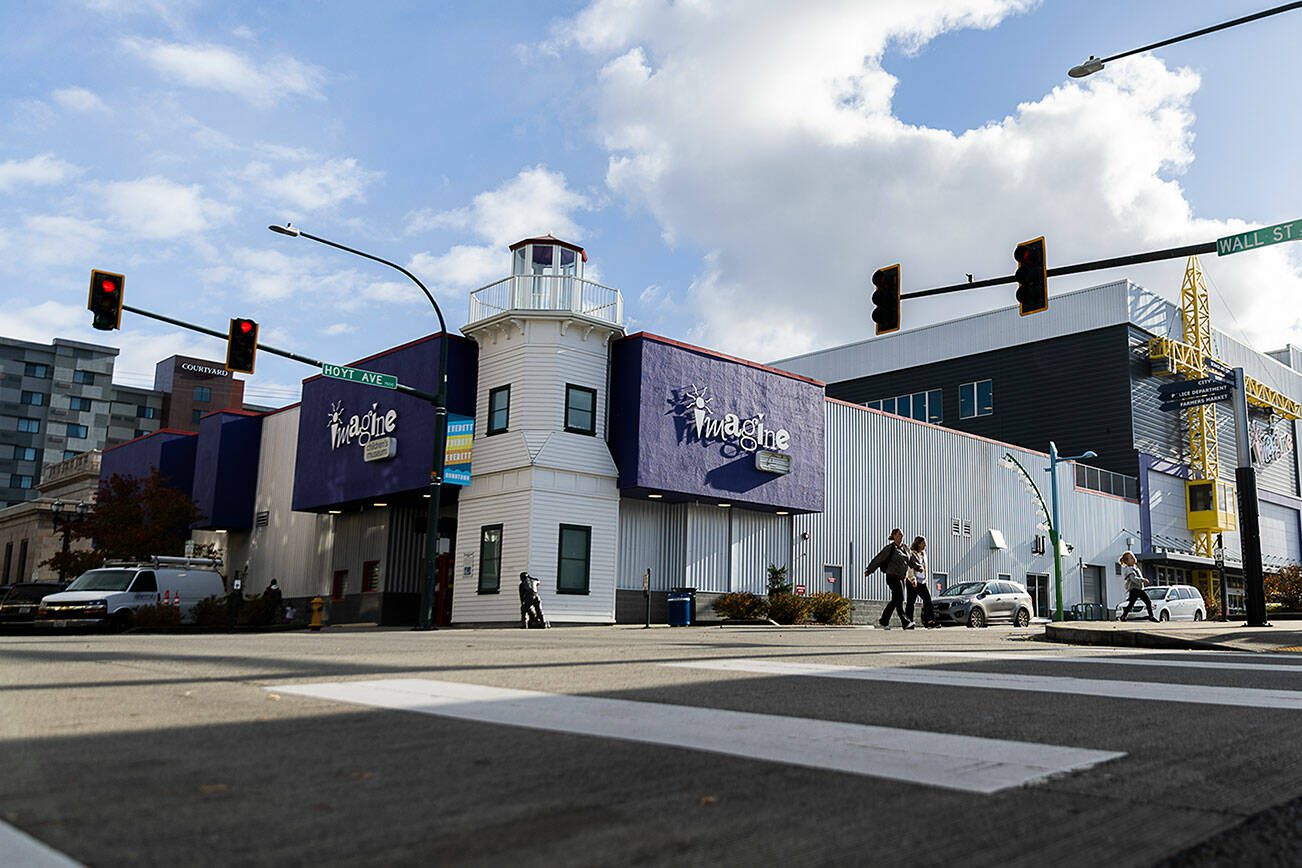 People cross Hoyt Avenue next to the Imagine Children’s Museum on Friday, Nov. 15, 2024 in Edmonds, Washington. (Olivia Vanni / The Herald)