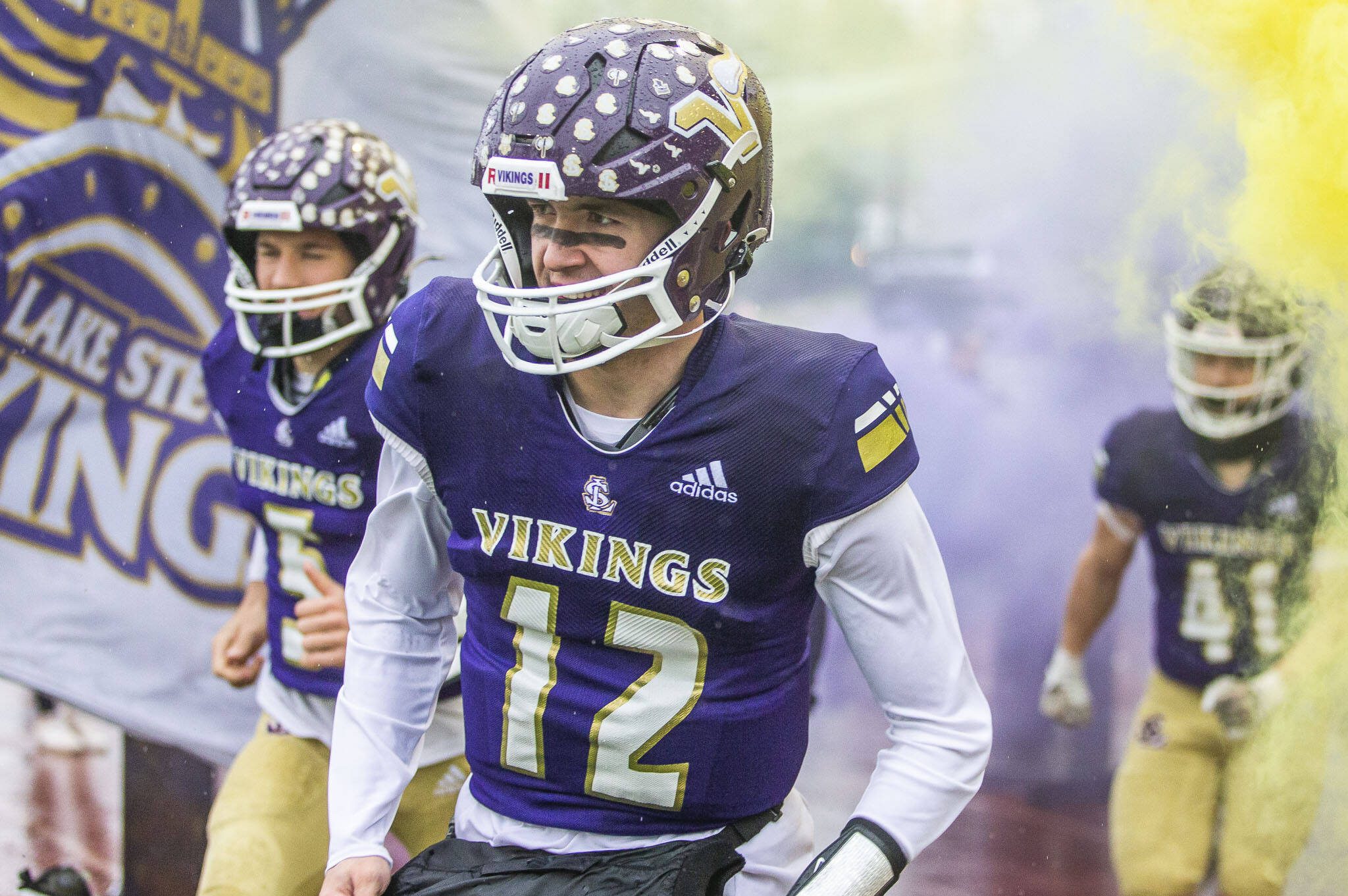 Lake Stevens’ Kolton Matson runs onto the field with his teammates before the start of the 4A state playoff game against Mead on Saturday, Nov. 16, 2024 in Lake Stevens, Washington. (Olivia Vanni / The Herald)