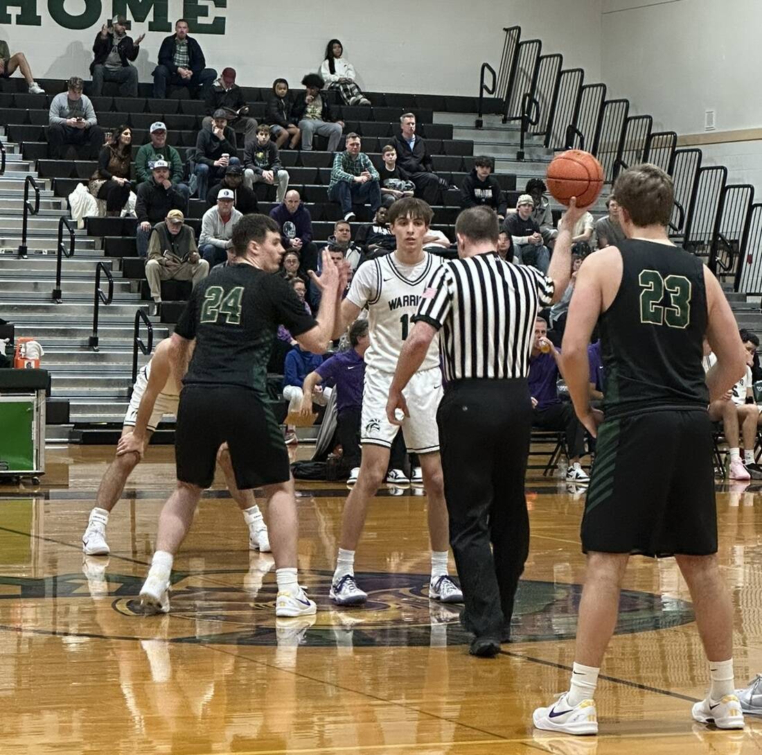 Marysville Getchell and Edmonds-Woodway boys basketball teams prepare for tip-off ahead of a Dec. 23 non-league matchup at Edmonds-Woodway High School. (Qasim Ali / The Herald)